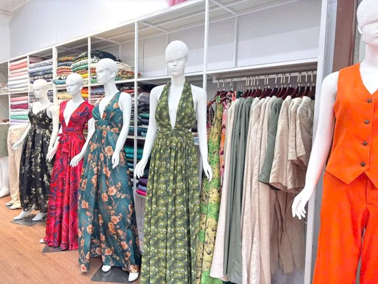 Dresses and garments displayed inside Bao An Tailor at Le Loi